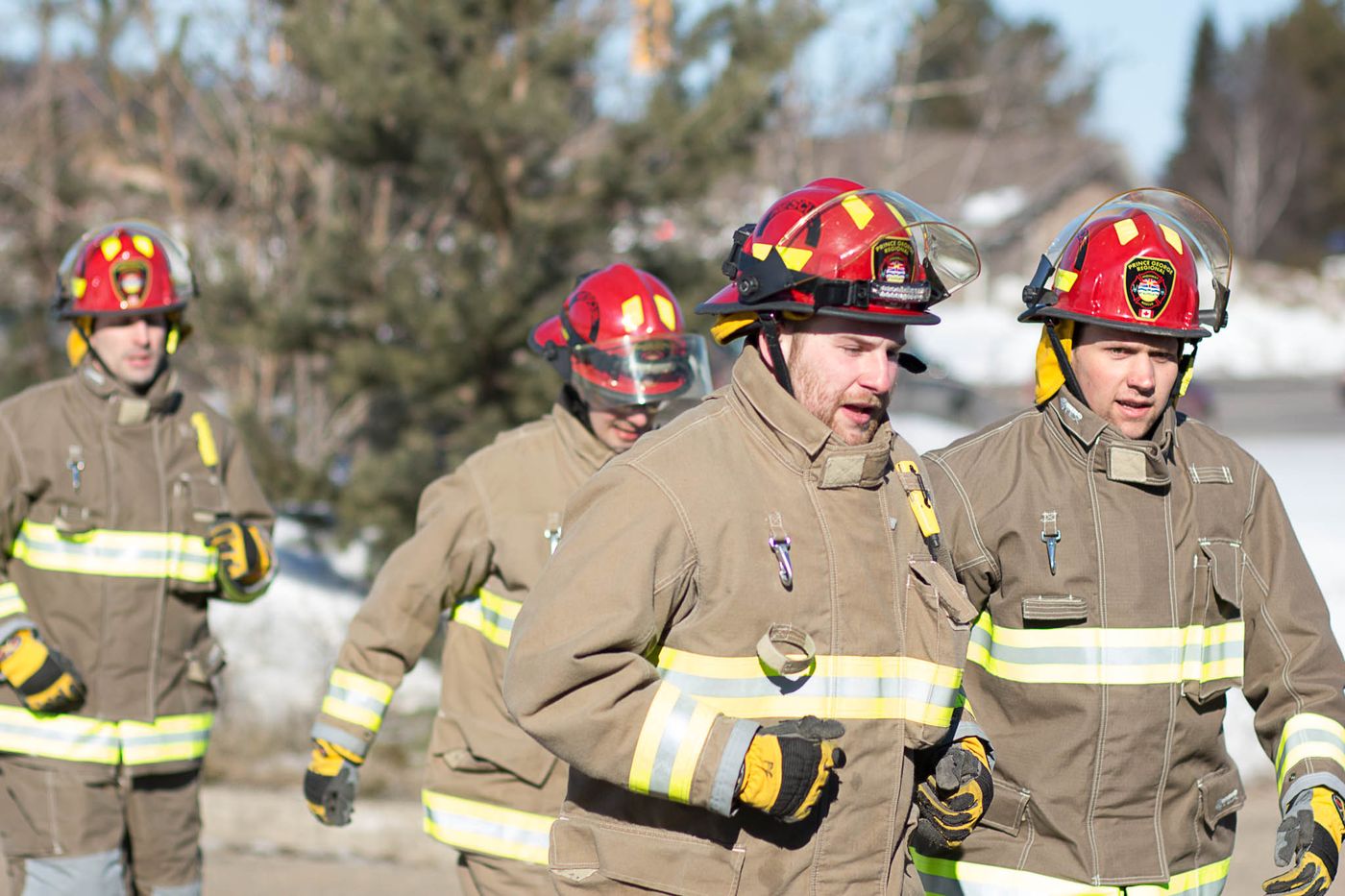 Highway Rescue members in bunker gear and helmets walking together